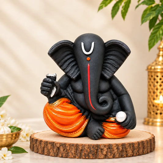 Black Ganesha Idol with Orange Dhoti, Resin Statue for Home Decor